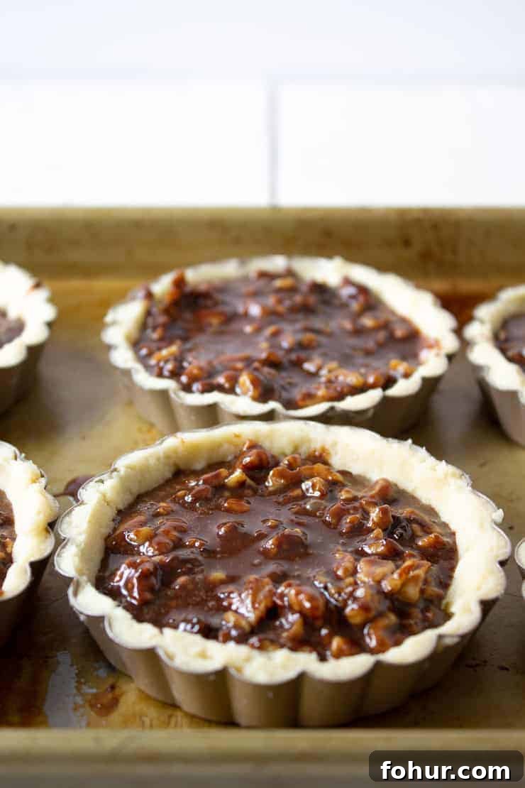 Decadent Chocolate Walnut Tart Recipe 4 Tart crusts filled with a chocolate walnut filling.