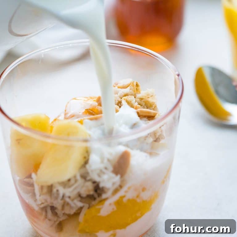 Authentic Swiss Bircher Muesli Recipe 10 pouring milk over muesli.