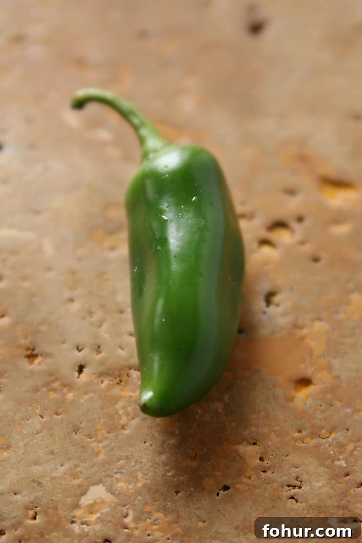 Mexican Chiles: Fresh and Dried Pepper Varieties 6 Fresh green jalapeño chile pepper, a medium-heat Mexican chile commonly used in salsa, guacamole, escabeche, and tacos.