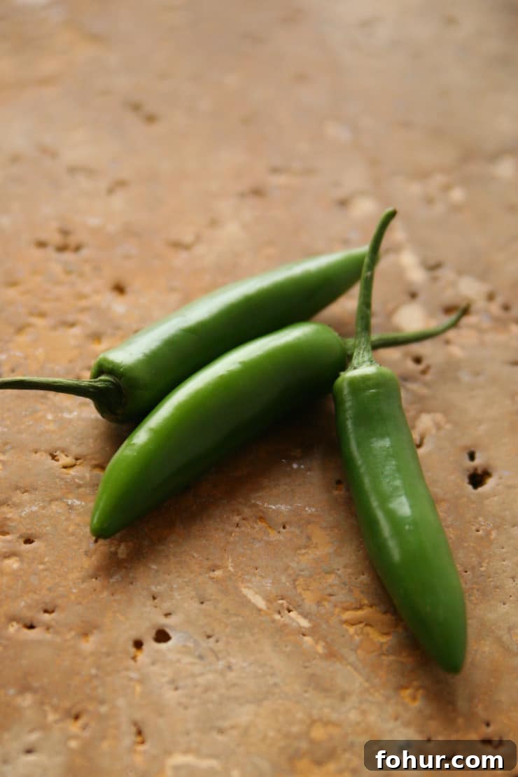 Mexican Chiles: Fresh and Dried Pepper Varieties 7 Fresh serrano chile pepper, a hot Mexican chile with bright, crisp flavor that's popular in salsa verde and pico de gallo.