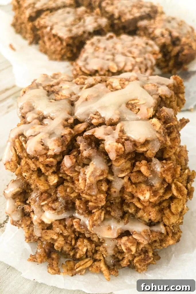 Cinnamon Roll Oatmeal with a vanilla glaze stacked on top of each other