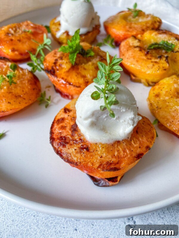 Grilled peach halves with ice cream
