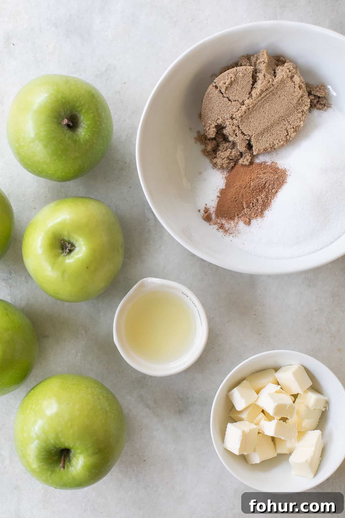 Campfire Apple Pie Recipe for Camping 3 apples, lemon juice, spices, sugar and butter in bowls