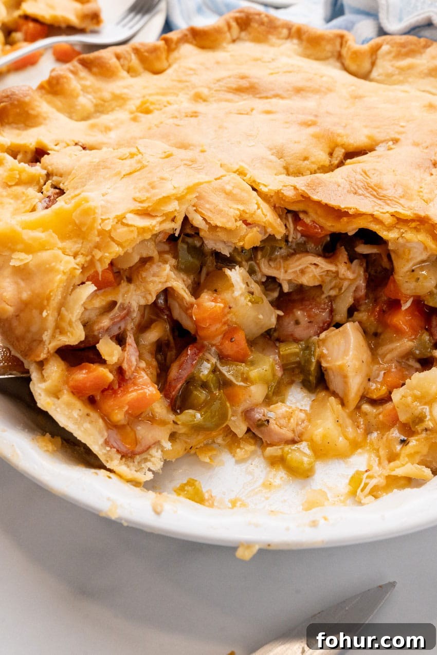 Smoked Sausage and Chicken Pot Pie Recipe with Flaky Crust 2 smoked sausage and chicken pot pie in a white pie plate