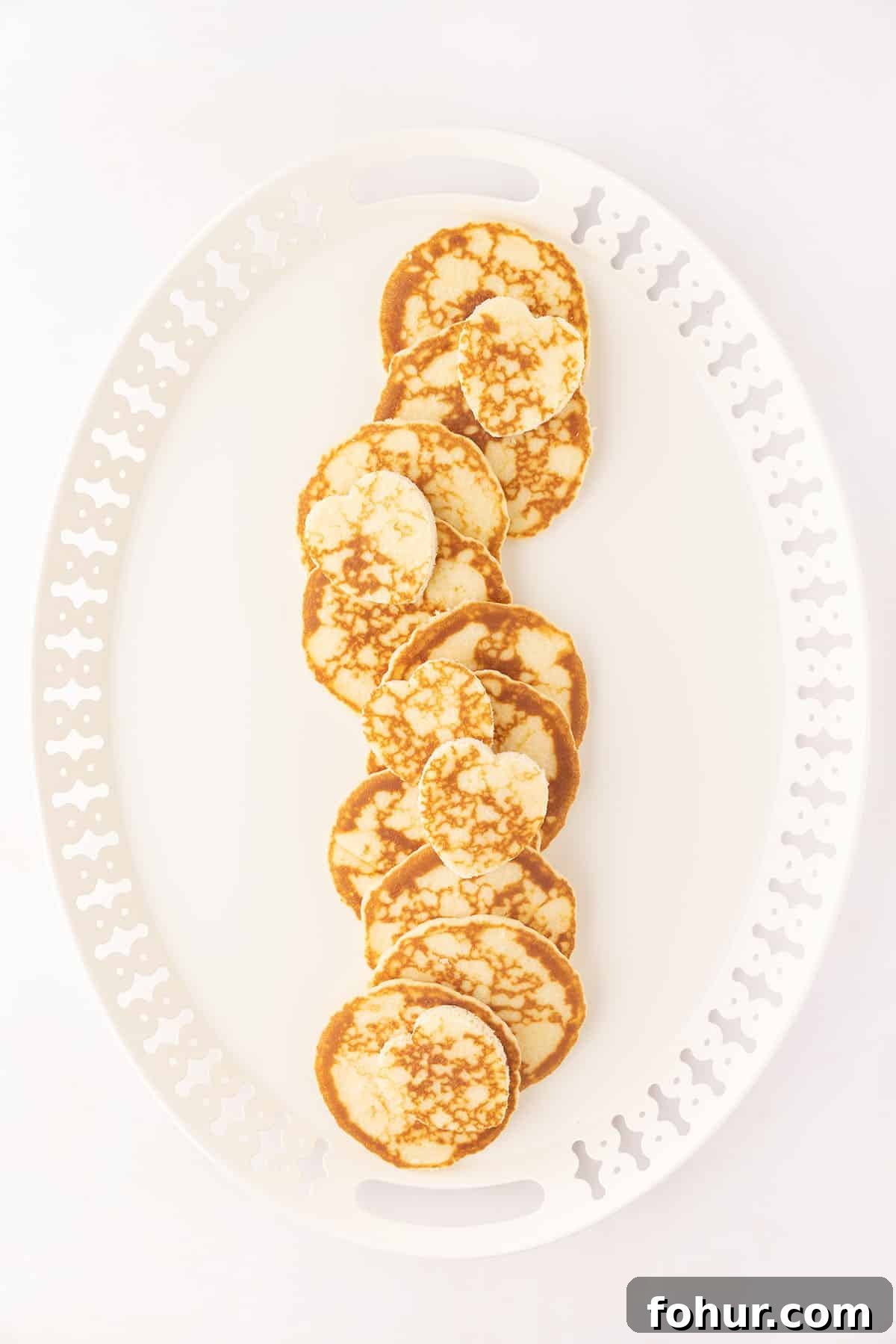Valentine's Day Charcuterie Board for Two 5 Mini pancakes on a white plate.