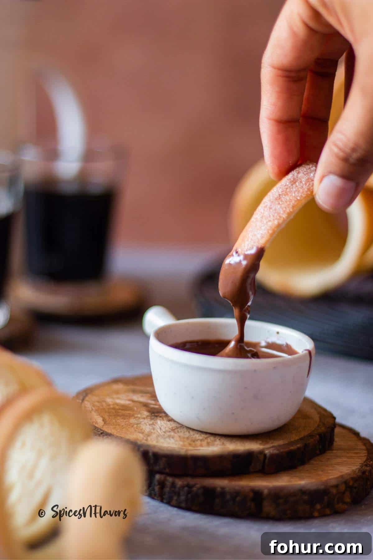 How to Make Authentic Hungarian Chimney Cake (Kürtőskalács) 10 piece of bread dipped in melted chocolate