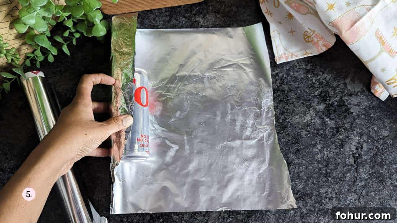 How to Make Authentic Hungarian Chimney Cake (Kürtőskalács) 7 cover the soda cans in aluminium foil