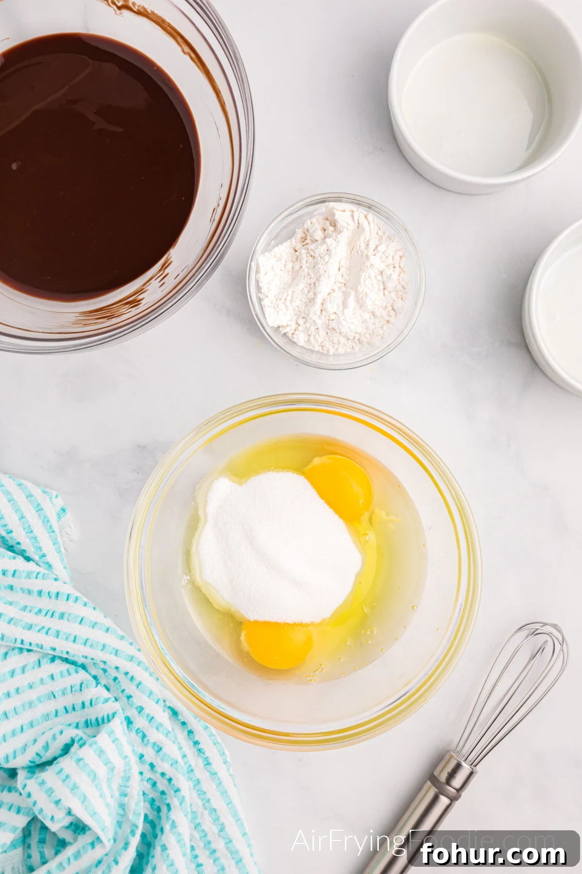Eggs in a bowl ready to be whisked and added to the chocolate.