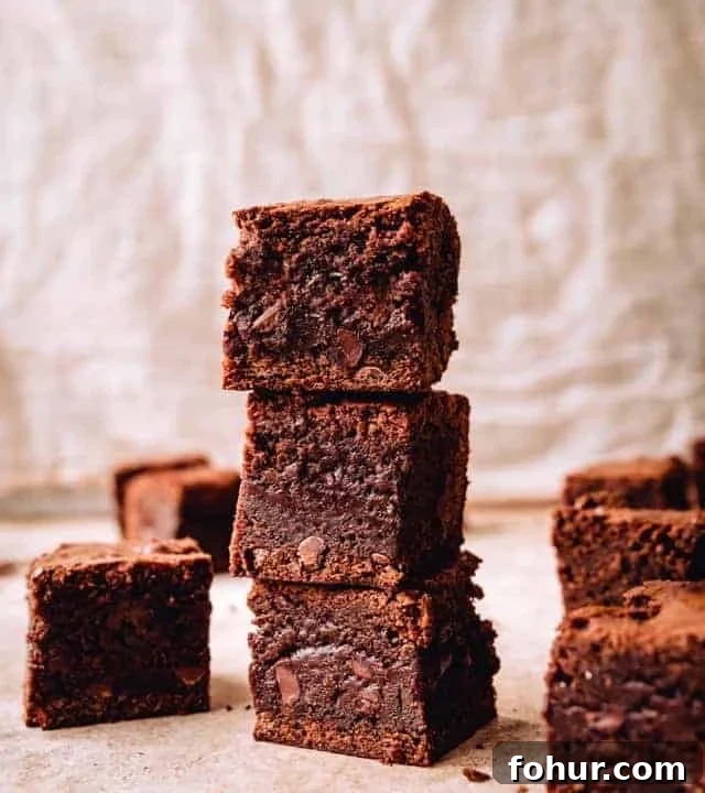 tall stack of three chewy chocolate brownies