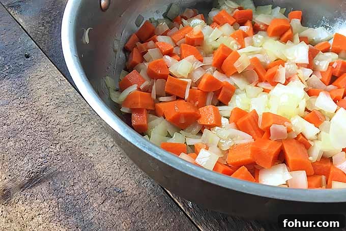 Creamy Saffron Chickpea Stew Recipe 6 Cooking onions and carrots for a soup