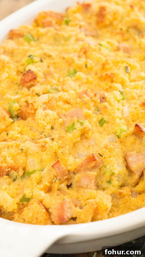 Cornbread stuffing with sausage in a white casserole dish