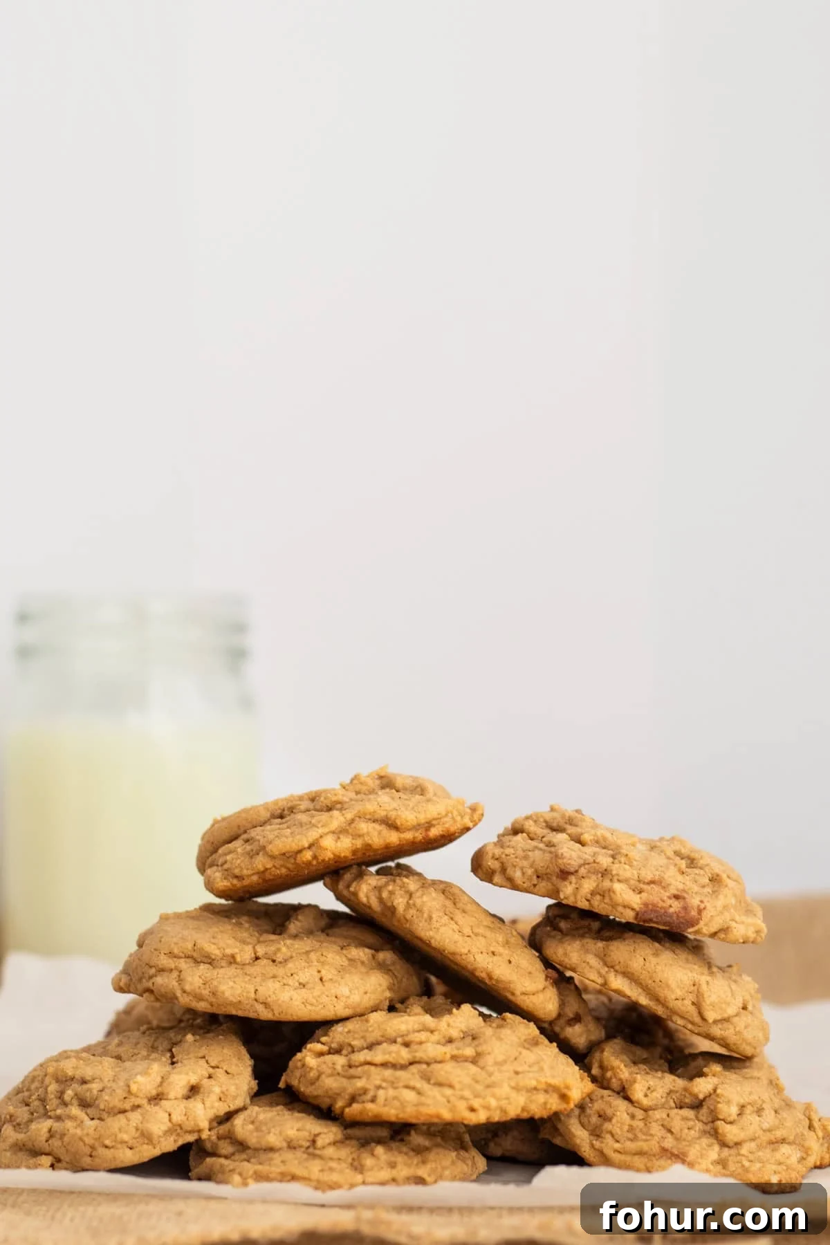 3-Ingredient Spice Cake Mix Cookies Recipe 2 a pile of spice cake cookies on parchment paper