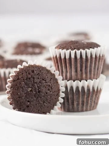 three brownies on a small white plate.
