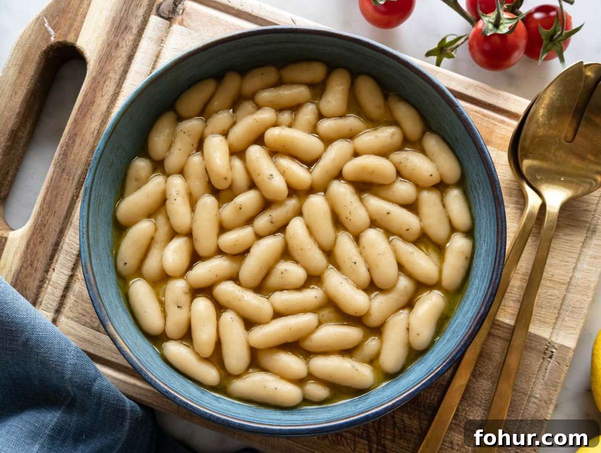 Hearty Mediterranean White Bean Salad with Herbs and Lemon 5 Step 2 Cannellini beans marinating in honey mustard dressing for extra flavor.