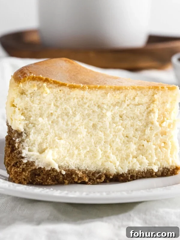 Classic New York style cheesecake on a plate.