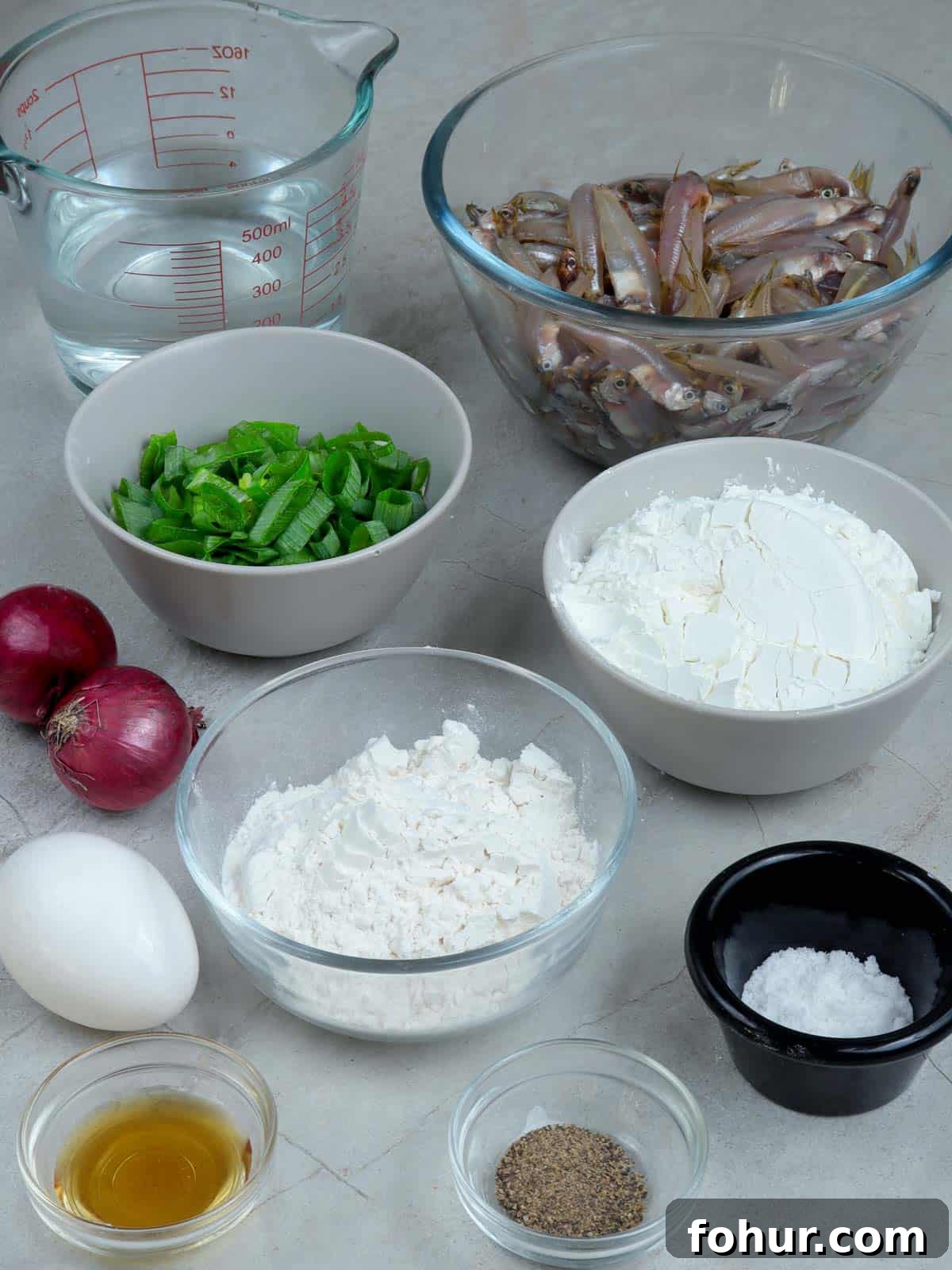 Crispy Ukoy na Dilis Recipe: Filipino Anchovy Fritters 2 anchovies, green onions, shallots, flour, cornstarch, water, egg, fish sauce, salt, pepper in bowls