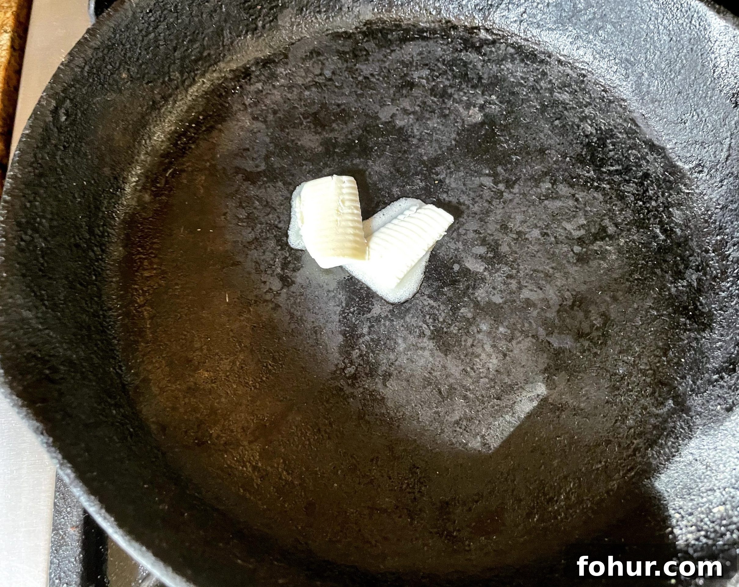 Grease preheated cast iron skillet. Grease preheated cast iron skillet.