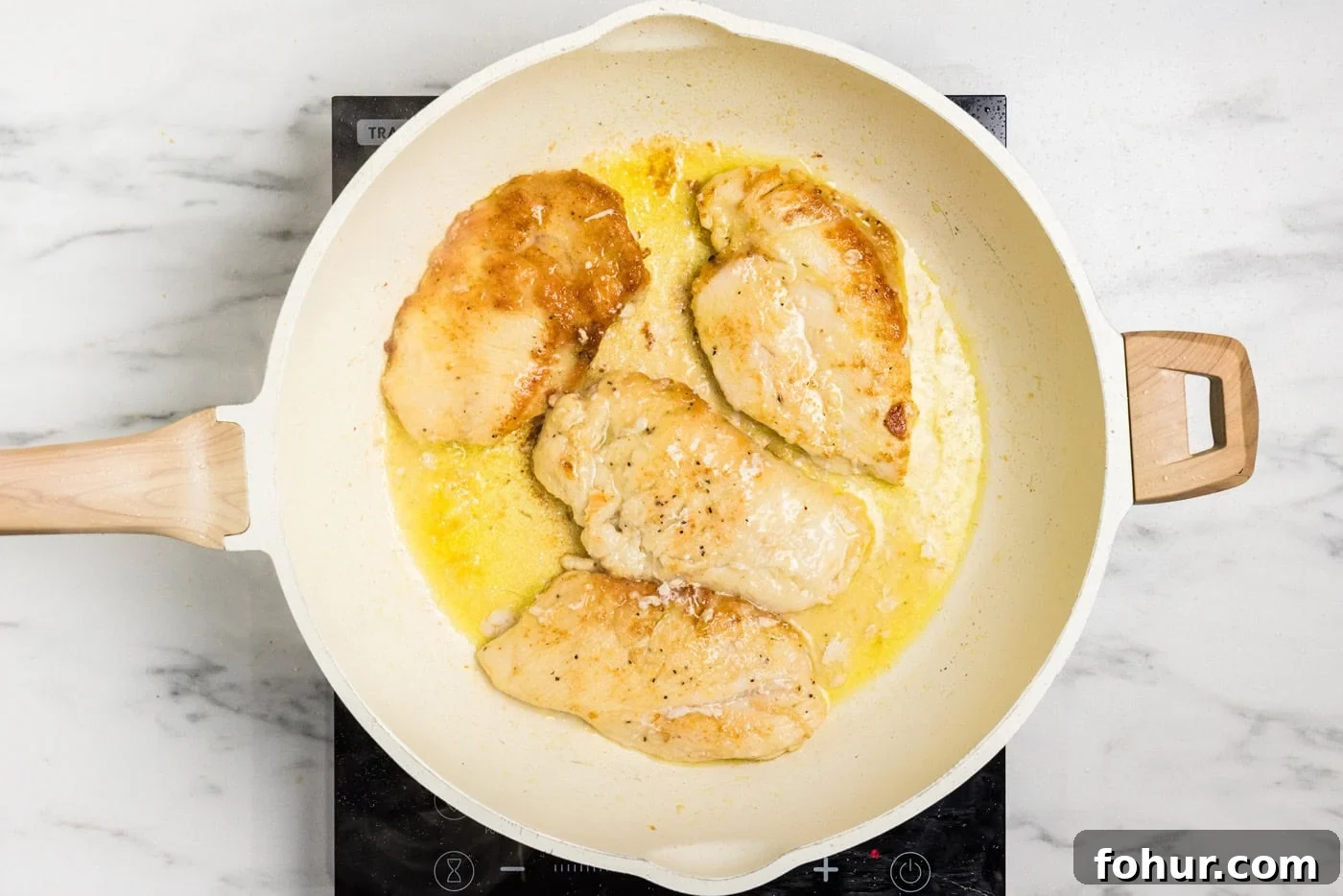 Crispy Chicken Scallopini with Lemon Butter Sauce 7 browned chicken cutlets in skillet