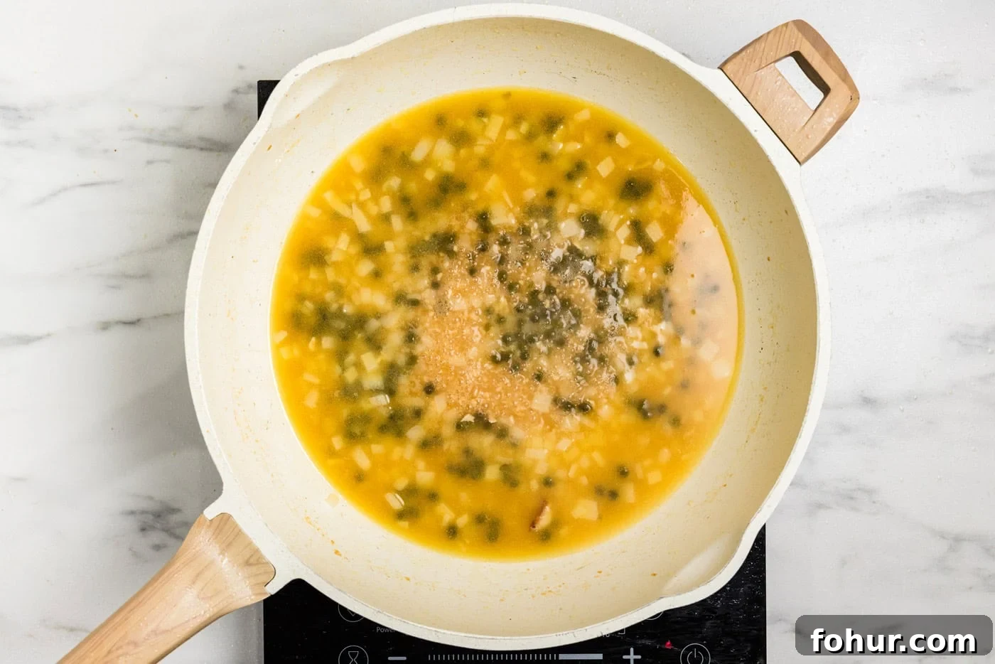 Crispy Chicken Scallopini with Lemon Butter Sauce 8 capers and broth in skillet