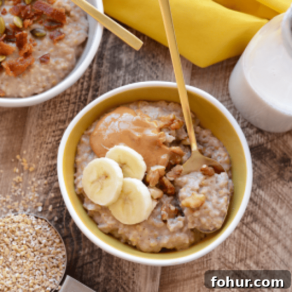 A bowl of oatmeal with bananas and peanut butter.
