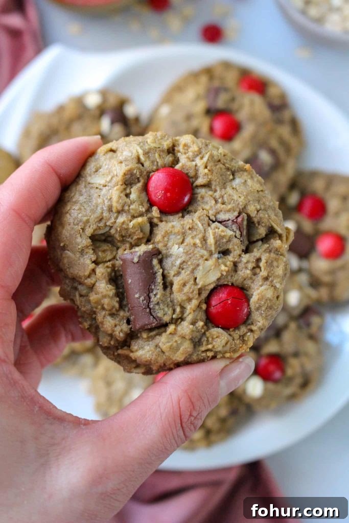 Nut-Free Monster Cookies Recipe with M&Ms 2 Holding chocolate chip Monster Cookies