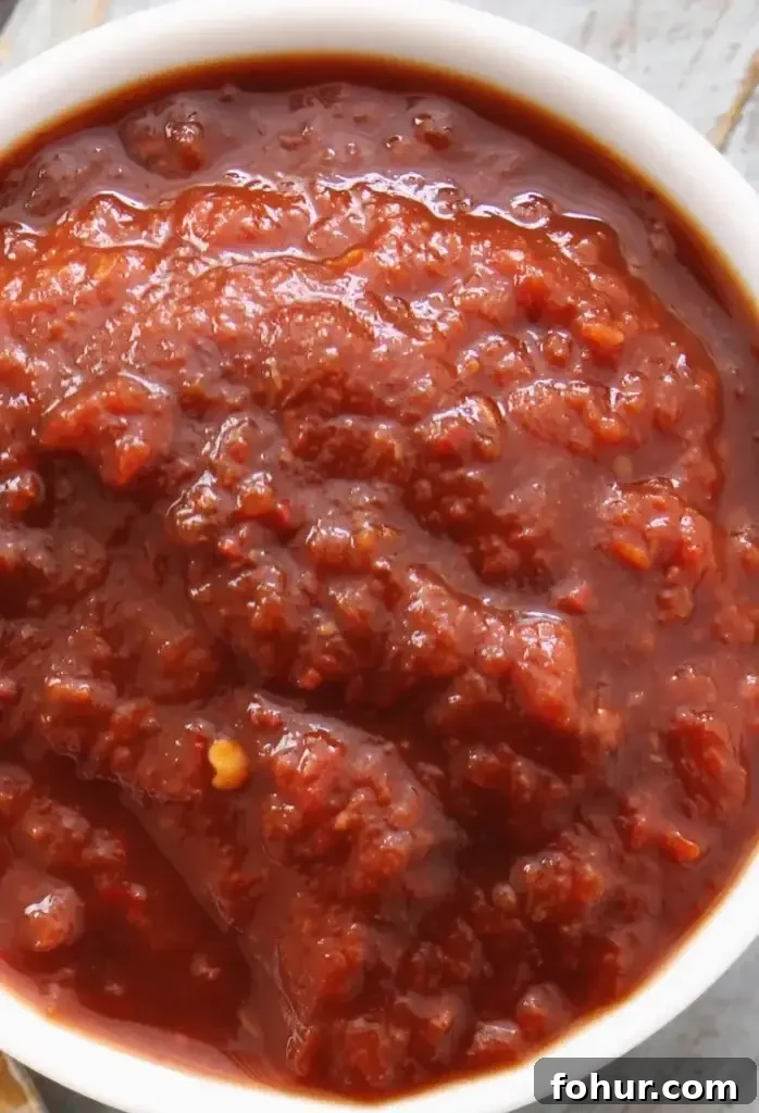 Raspberry Chipotle Sauce Recipe for Grilled Meats 3 Sauce cooking in pan