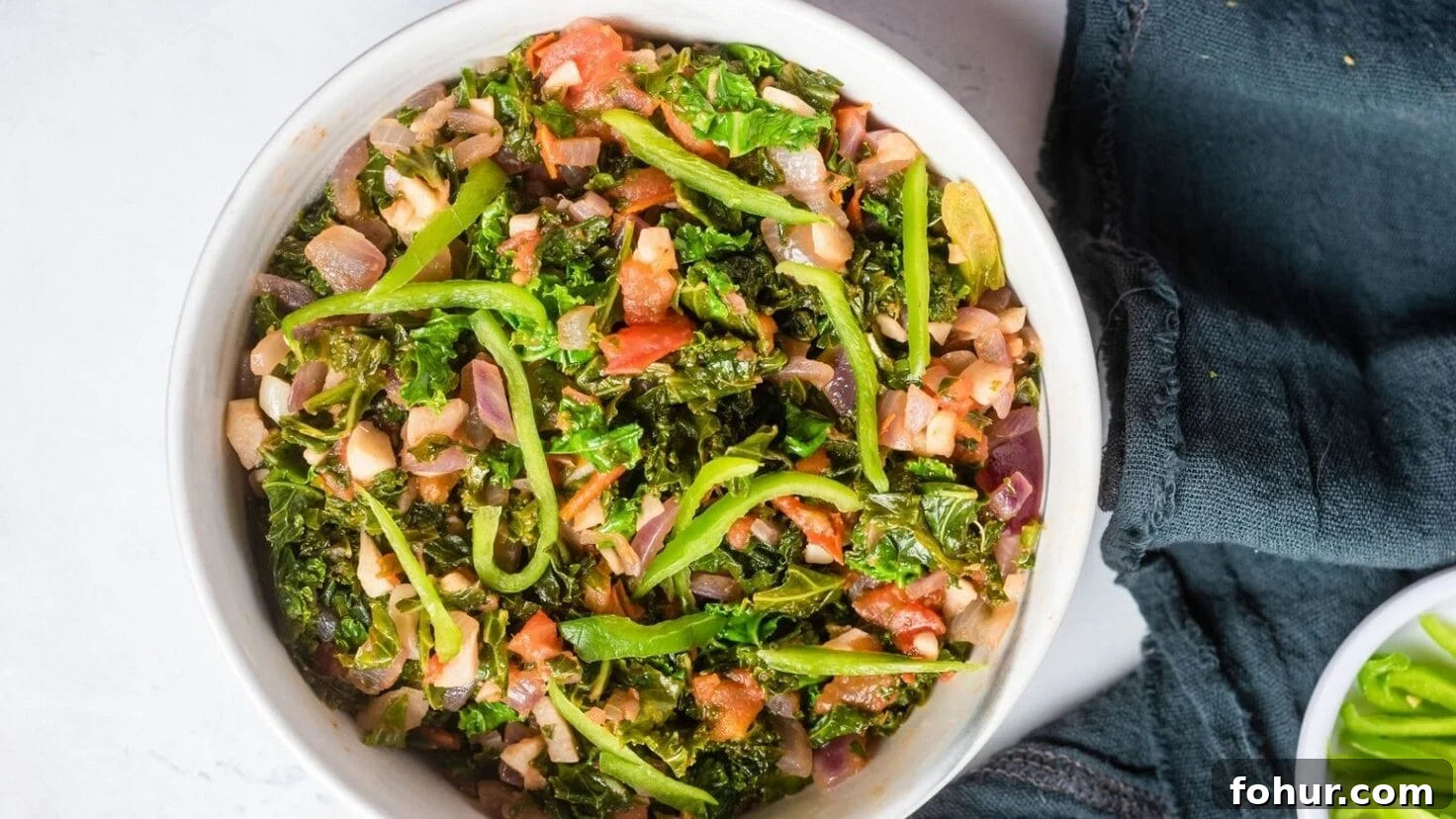 Gomen Wat: Spicy Ethiopian Collard Greens Recipe 8 An overhead view of gomen wat in a white bowl.