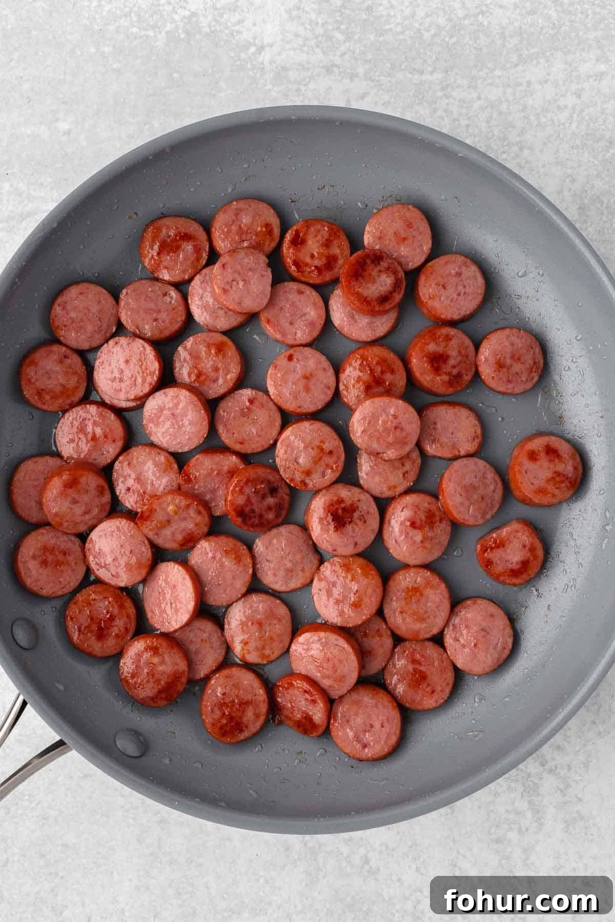 One-Pot Creamy Kielbasa and Smoked Sausage Pasta 4 Slices of Kielbasa cooked in a large skillet until lightly browned.