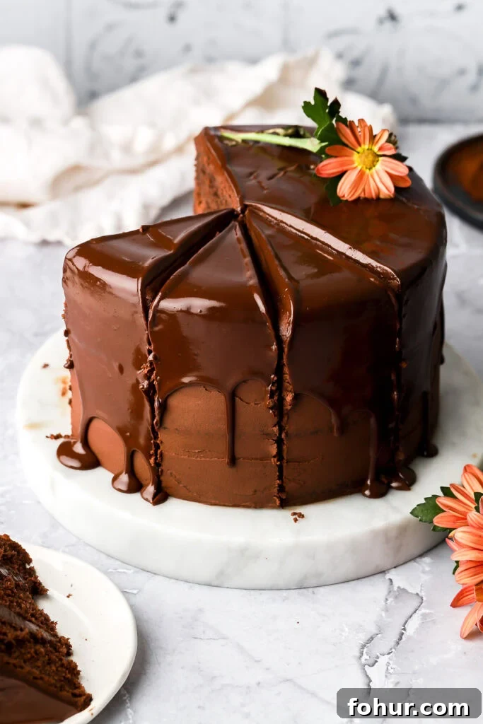Decadent Chocolate Ganache Cake Recipe 10 chocolate cake with chocolate drip sliced