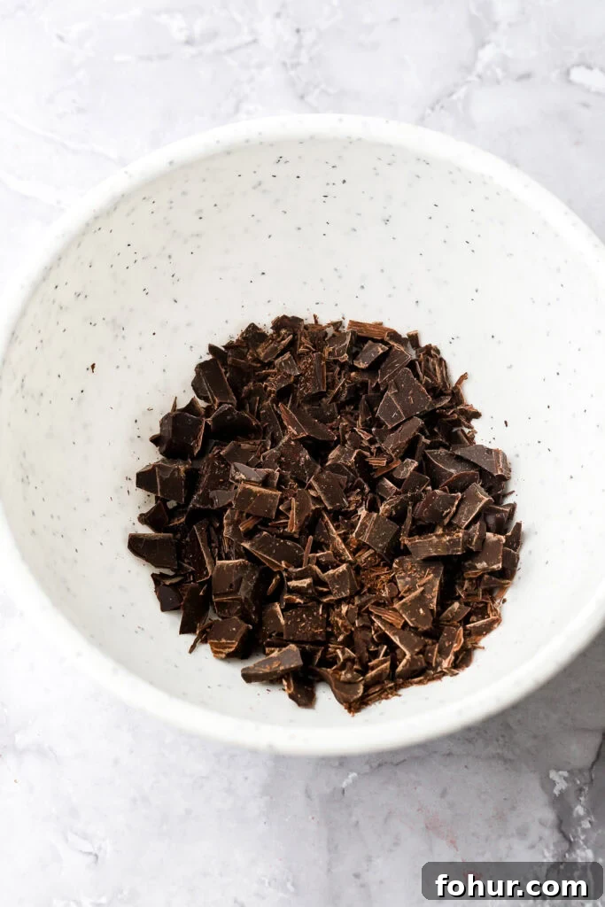Decadent Chocolate Ganache Cake Recipe 5 chocolate chopped small in a bowl