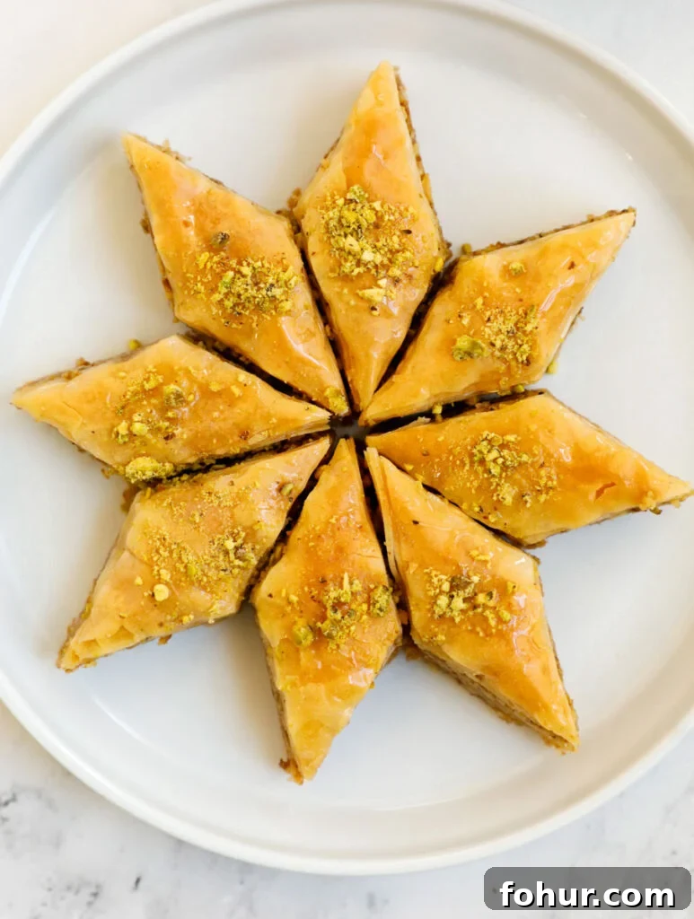 Homemade Walnut Baklava Recipe with Honey Syrup 3 A plate with eight portions of walnut baklava.