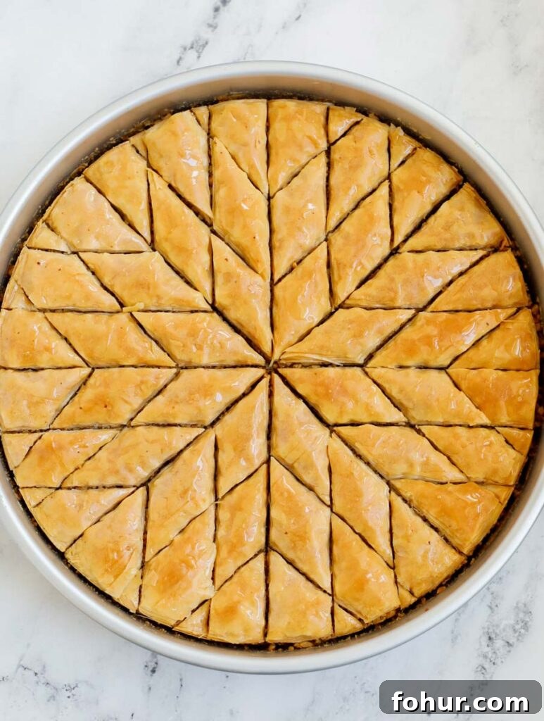 Homemade Walnut Baklava Recipe with Honey Syrup 7 Baked walnut baklava cut into diamond shapes.
