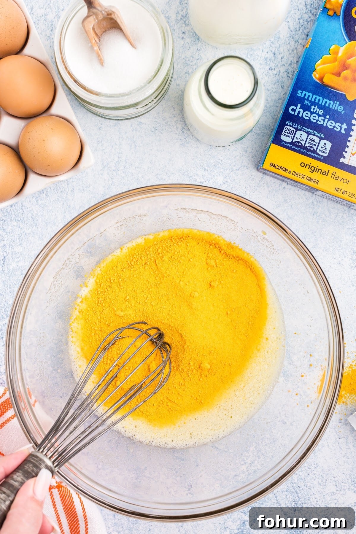 Copycat Mac and Cheese Ice Cream Recipe 5 Adding in the sugar and cheese into the egg mixture.