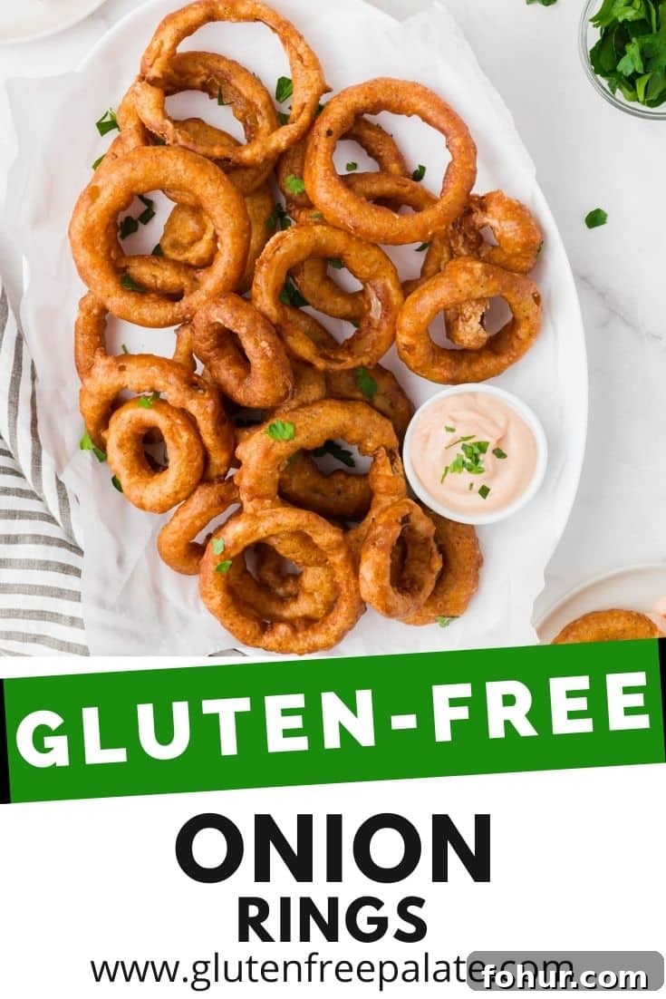 Crispy Gluten-Free Onion Rings Recipe 7 an oval platter of battered onion rings with a side of creamy dip. Text overlay says Gluten Free Onion Rings