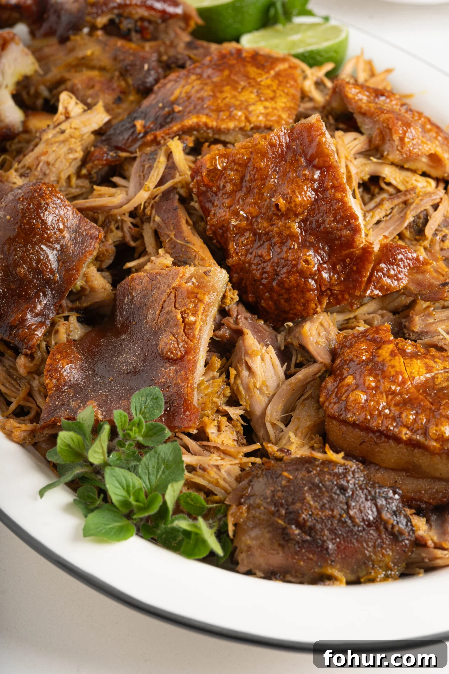 Crisp, Tender Puerto Rican Pernil: Roast Pork Shoulder 10 A plate of Puerto Rican pernil.