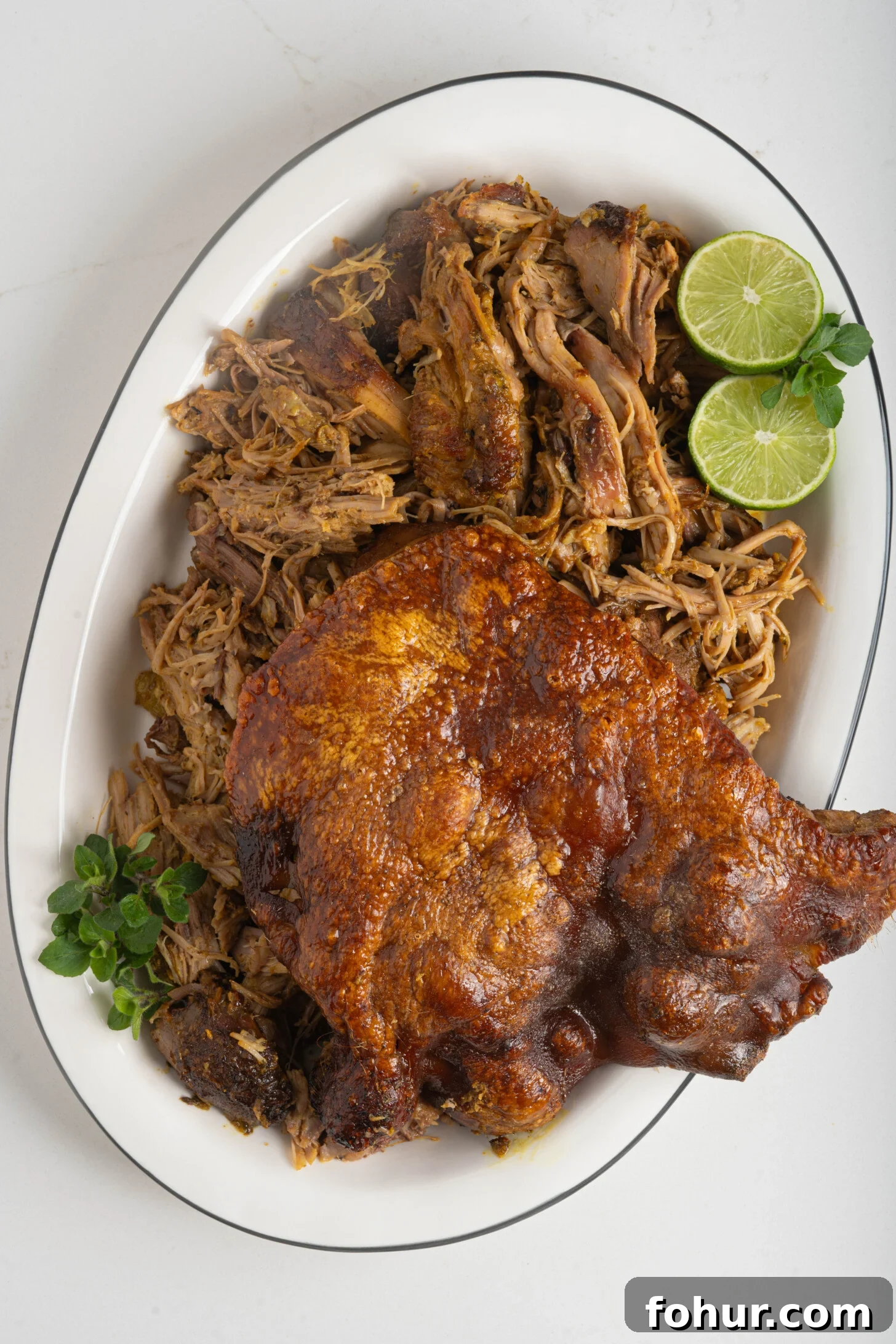 Crisp, Tender Puerto Rican Pernil: Roast Pork Shoulder 13 A plate of Puerto Rican pernil.