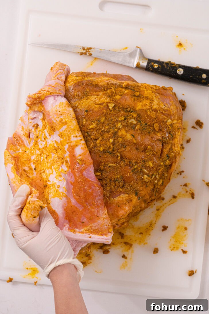 Crisp, Tender Puerto Rican Pernil: Roast Pork Shoulder 5 A marinated raw pork shoulder.
