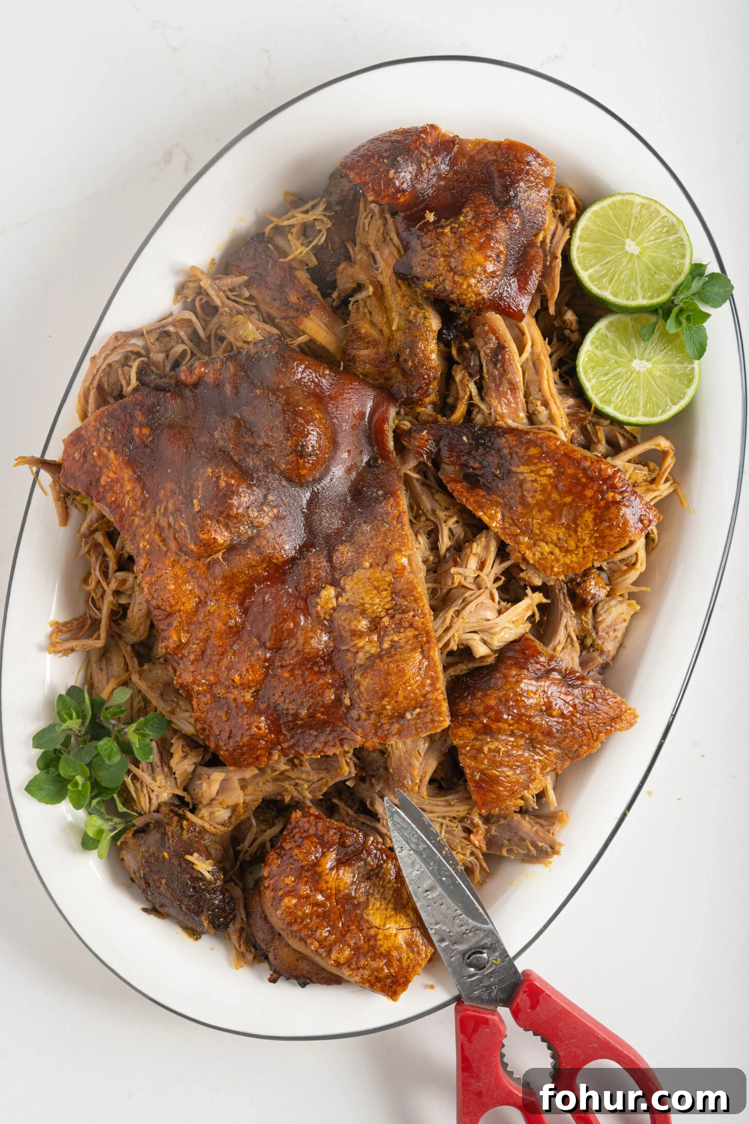 Crisp, Tender Puerto Rican Pernil: Roast Pork Shoulder 9 A plate of Puerto Rican pernil.