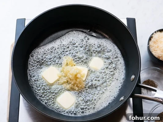 Creamy Fettuccine Alfredo: 30-Minute Vegetarian Recipe 3 Garlic and butter in a skillet