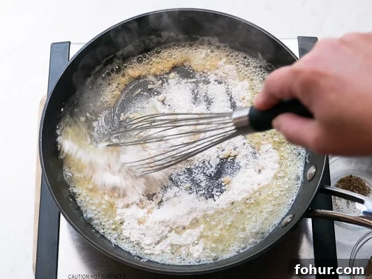 Creamy Fettuccine Alfredo: 30-Minute Vegetarian Recipe 4 Whisking flour into the garlic and butter