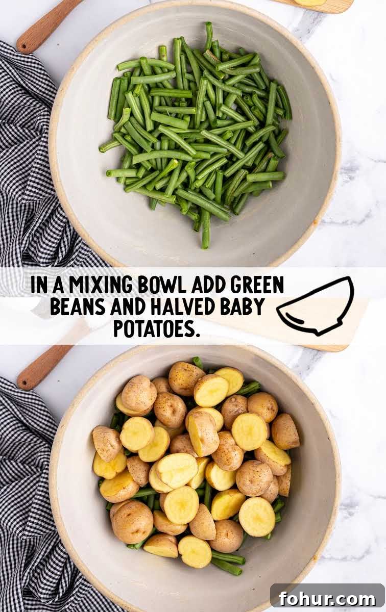 One-Pan Sausage, Green Bean and Potato Casserole 4 Sausage Green Bean Potato Casserole process shot of a bowl of green beans being topped with halved baby potatoes
