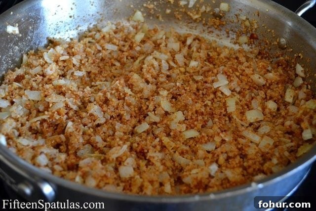 Chopped Walnuts and Softened Onion in Skillet