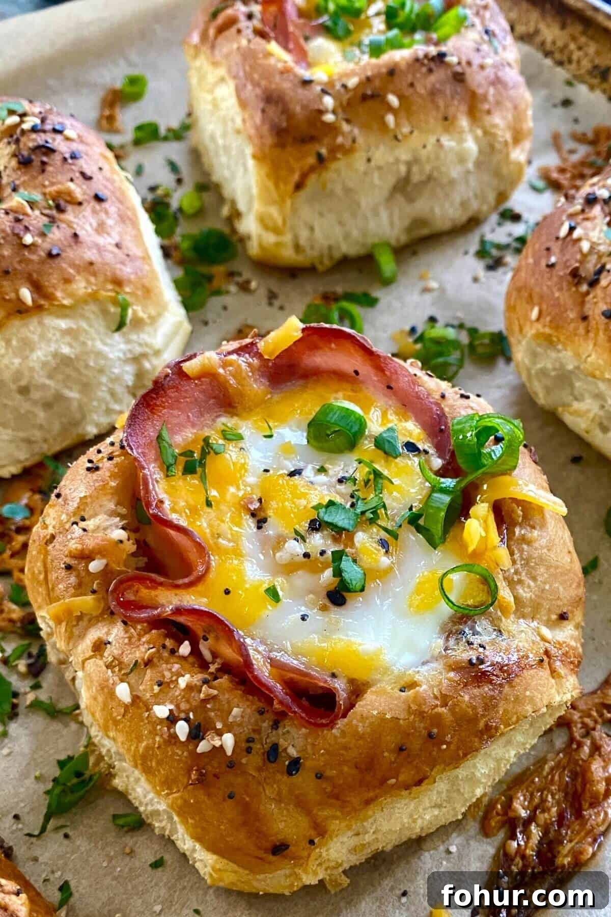 Baked Eggs in Mini Bread Rolls 2 a ham and egg sandwich in a bread bowl.