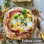 Baked Eggs in Mini Bread Rolls 9 A small bread bowl with baked ham and egg.