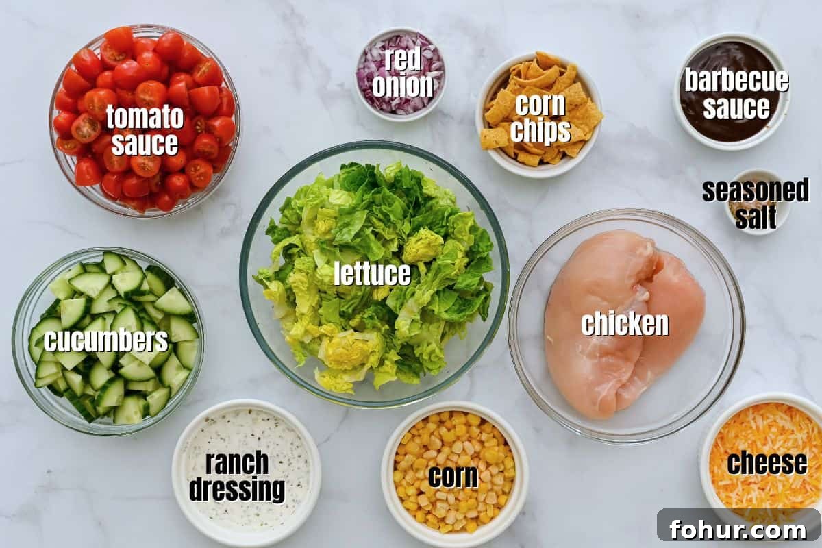 Ingredients for BBQ Chicken Salad with homemade BBQ ranch dressing labeled on counter.