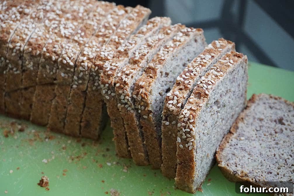 Gluten-Free Vegan Sourdough Bread, No Yeast or Xanthan Gum 3 Sliced Gluten Free Sourdough Bread on a wooden board, showing texture inside (Vegan Yeast Free, No xanthan, no psyllium, healthier flours)