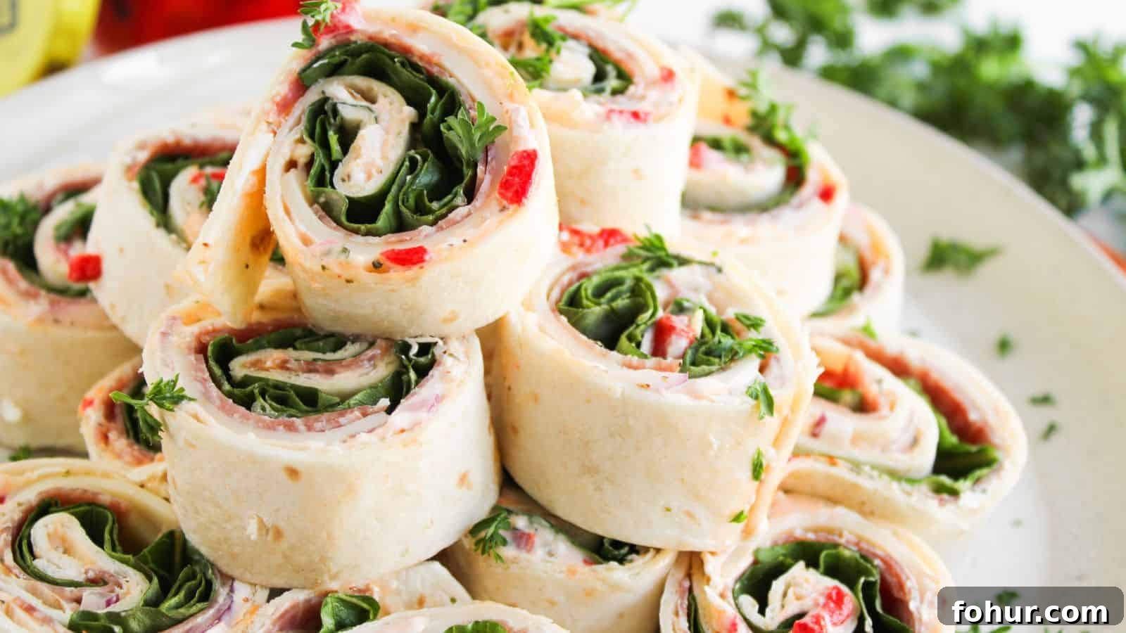 31 New Year's Eve Snacks for Late-Night Parties 28 A plate of tortilla pinwheel sandwiches filled with spinach, cream cheese, red peppers, and herbs, neatly stacked and garnished with parsley.