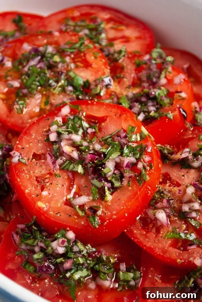 Marinated Italian Tomato Salad with Basil 2 a plate of Italian marinated tomato salad