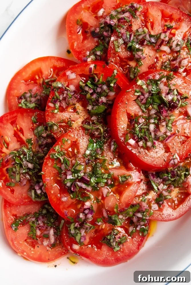 Marinated Italian Tomato Salad with Basil 4 a plate of marinated tomato salad