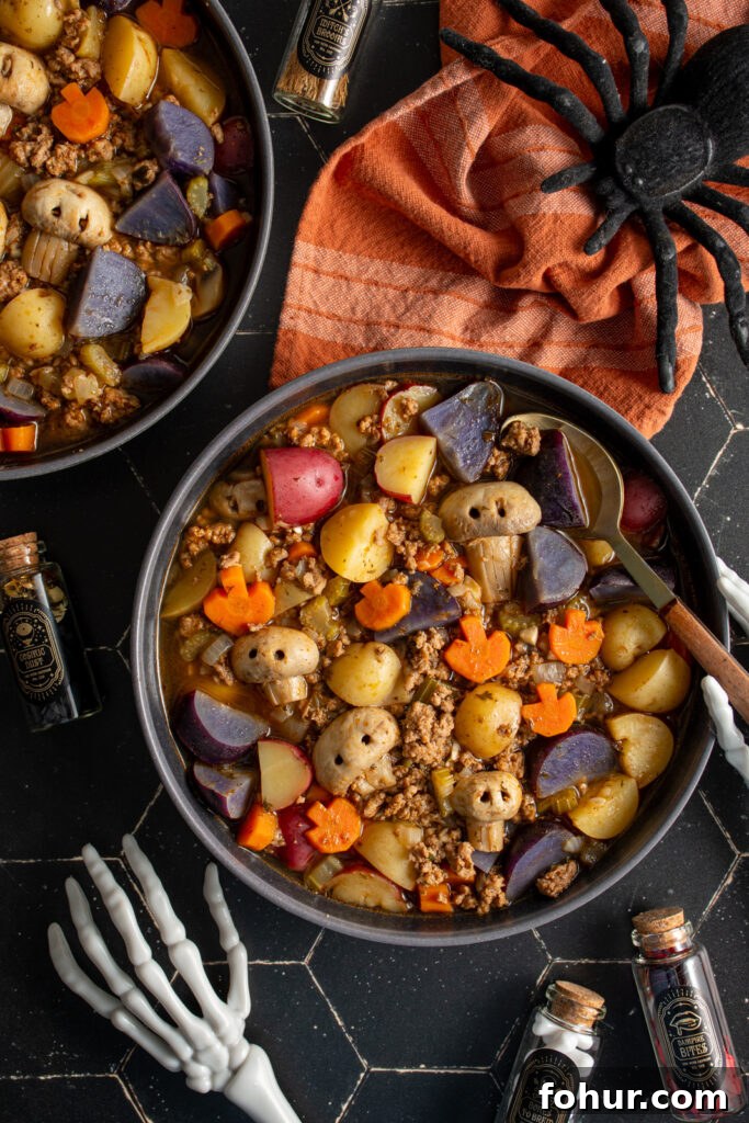Witches' Brew Stew: Halloween Soup Recipe 5 Bowls of witches brew Halloween soup with carved carrot pumpkins and mushroom skulls.